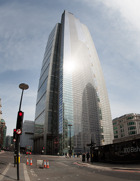 Image shows sunlight glinting off large glass skyscraper in London to illustrate the work of architectural glass manufacturer Kite Glass Weybridge