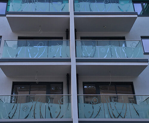 Decorative balconies at Troy Court featuring architectural glass by toughened glass suppliers Kite Glass Weybridge