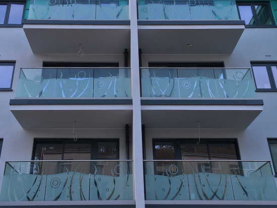 Decorative balconies at Troy Court featuring architectural glass by toughened glass suppliers Kite Glass Weybridge